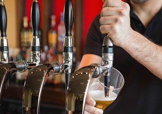 Image of bartender pouring drink